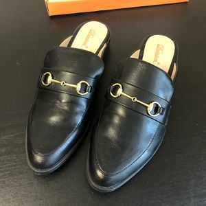 Black leather mules with gold buckle. 9.5